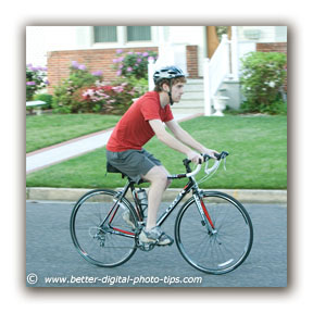 Example of Blurry Background From Background Motion - Bike Rider 1/125 Second