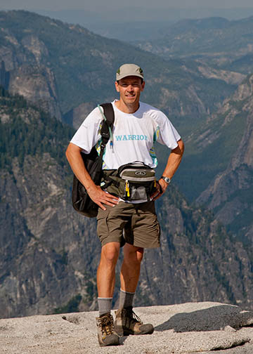 Traveling photographer on Half Dome