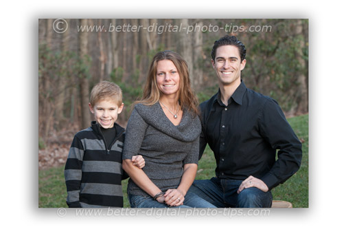 Small family of 3 photographed in the shade of their backyard