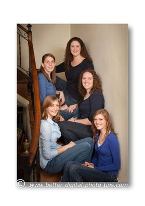 family posed on steps