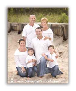 Look for a good background situation behind the family when you pose them