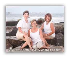 Pose of 3 adult females on the rocks