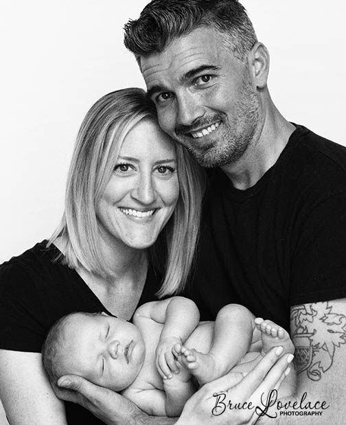 black white newborn family pose