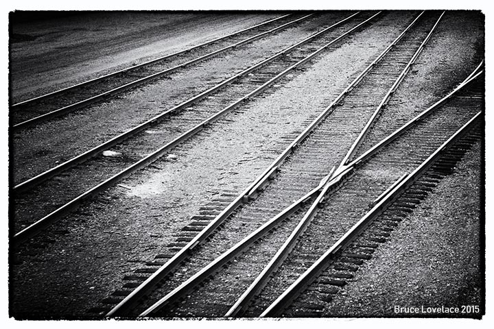 black white railroad tracks