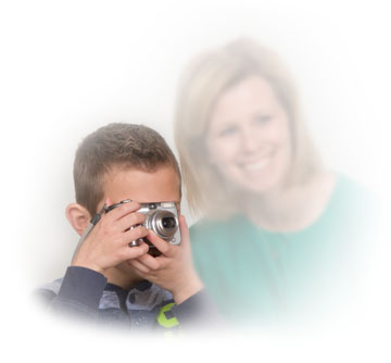 Boy with digital camera and mom