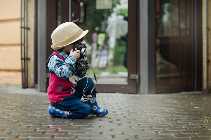 Young boy with film camera