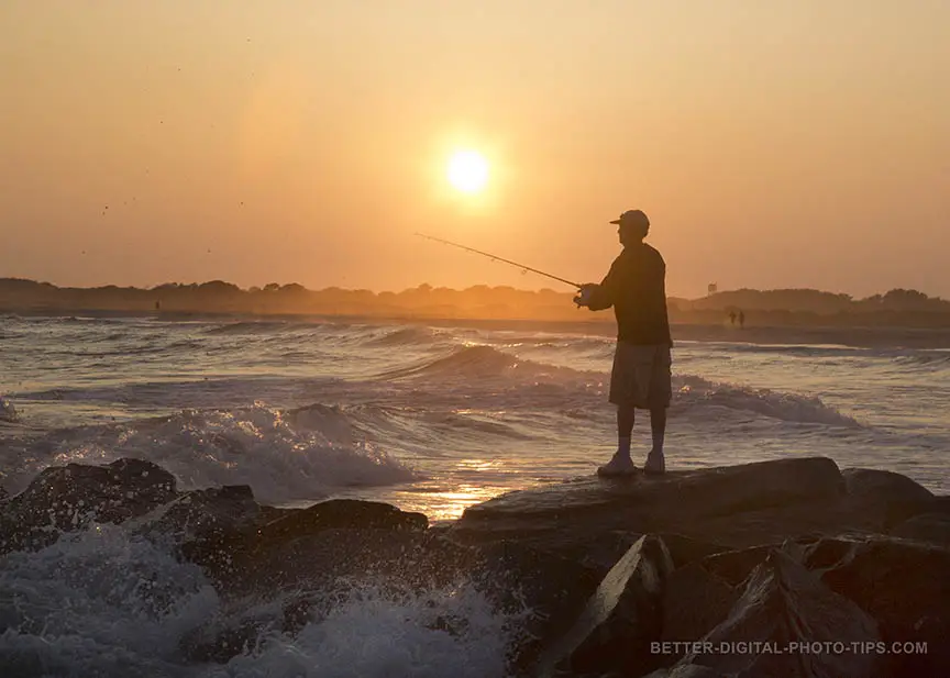 Cropped fisherman at sunset