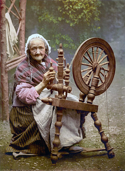 elderly woman and spinning wheel