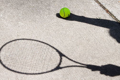 Shadowed tennis player