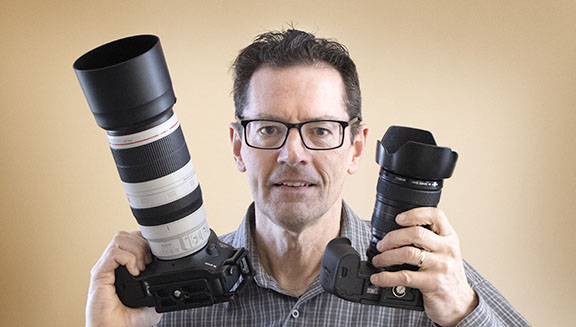 Photographer with two cameras