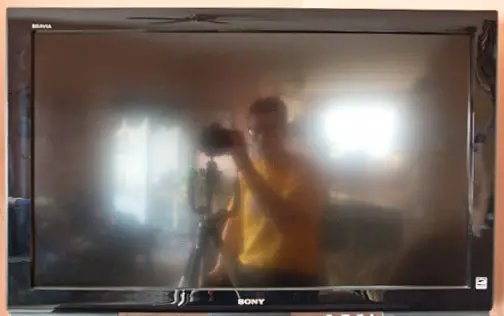 Television reflection selfie pose